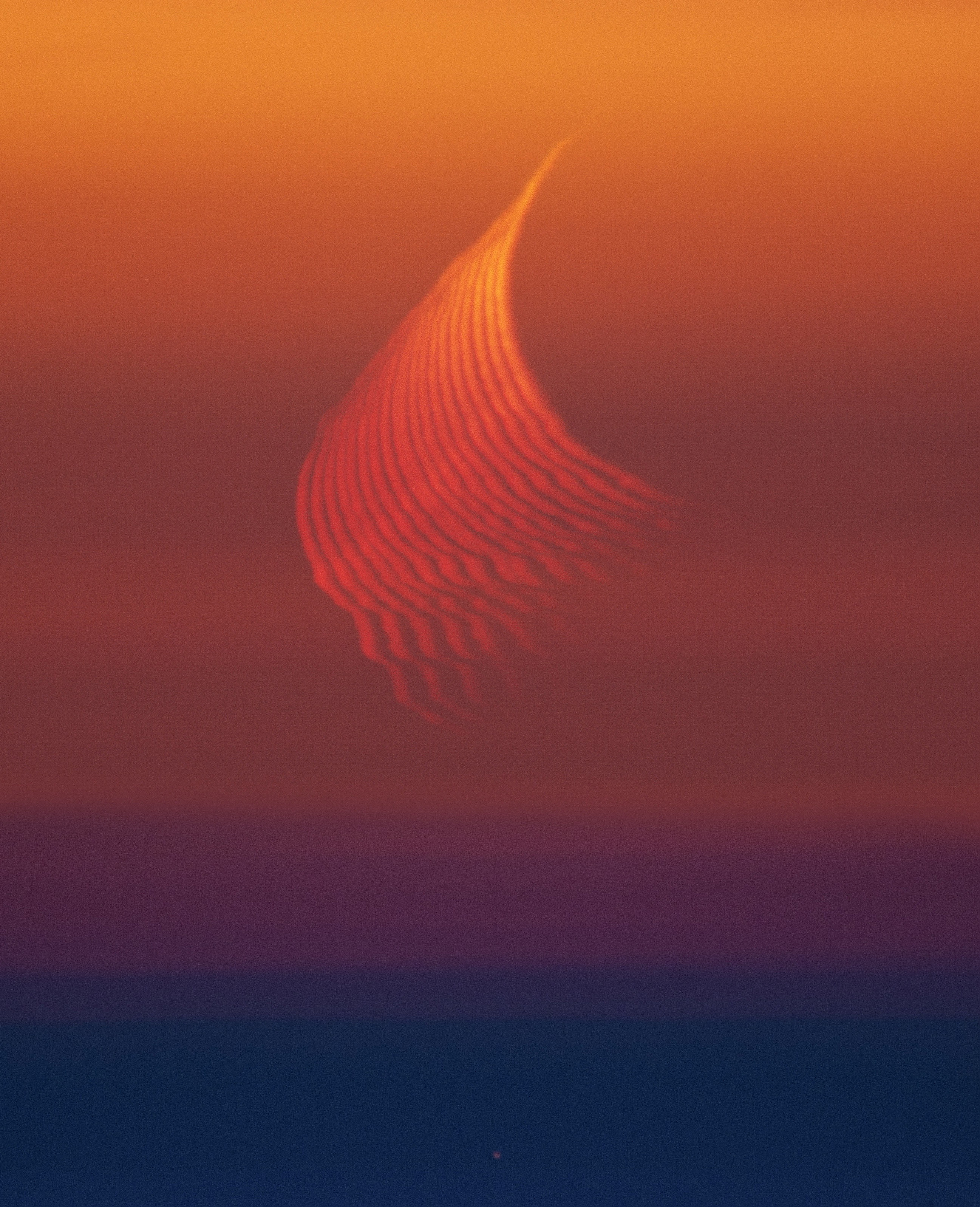 Thin multiple arcs of moonlight are visible in the sky, looking like curved threads